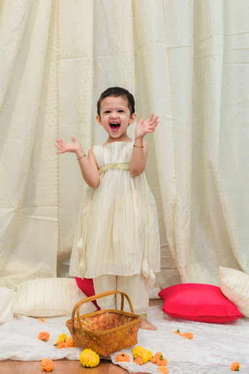 Ivory muslin peplum top and pant set