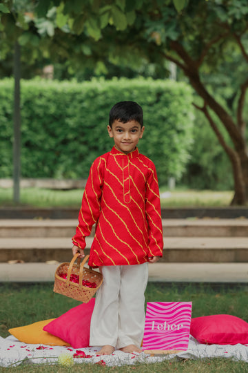 Red leheriya printed collared kurta and off white pants