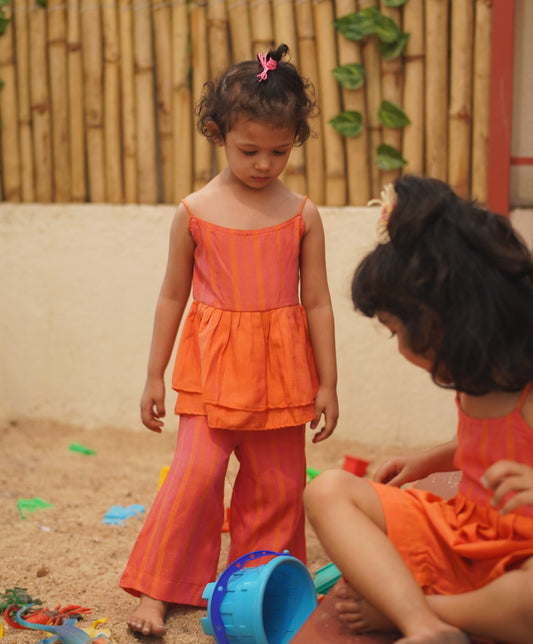 Tangy peplum top & pink pants