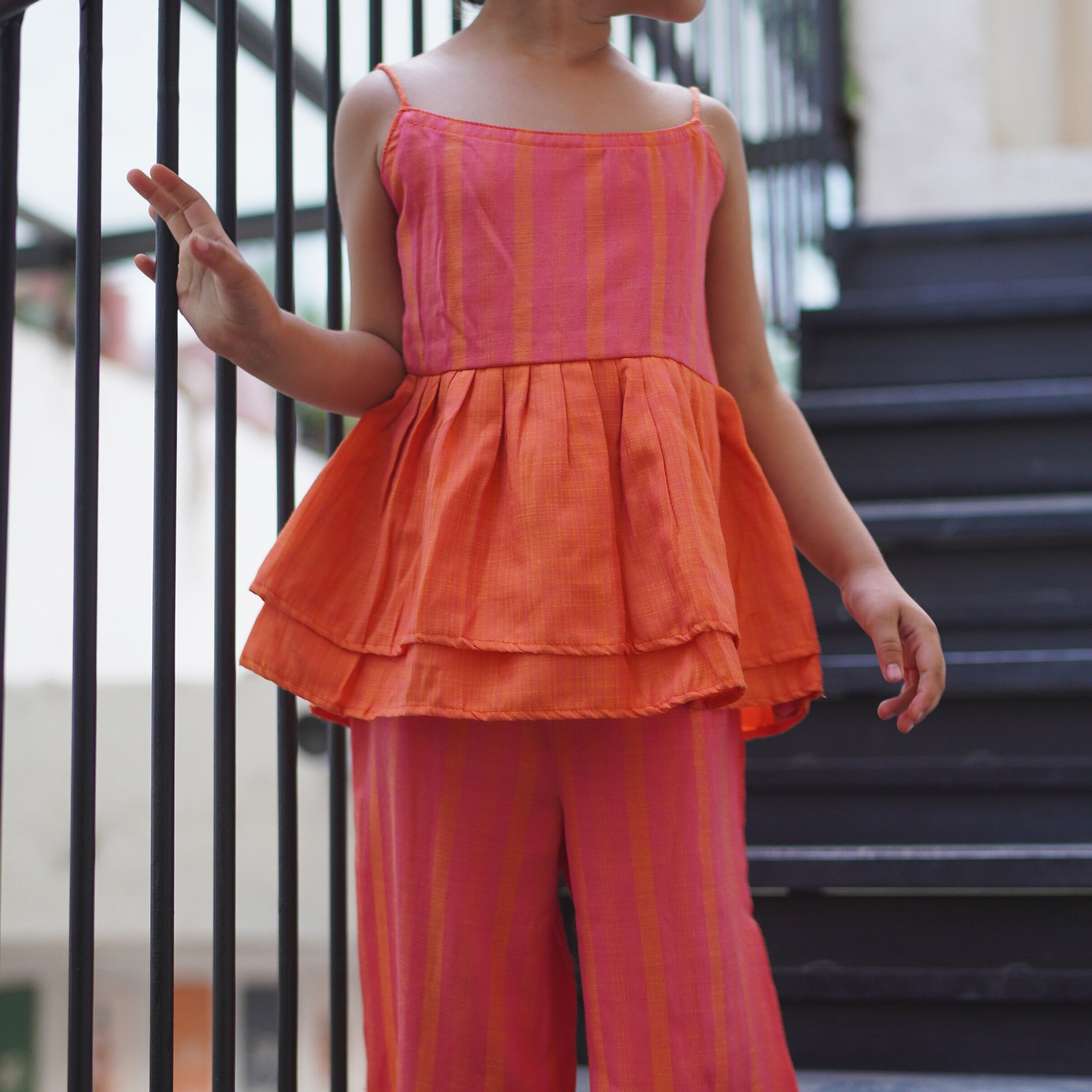 Tangy peplum top & pink pants